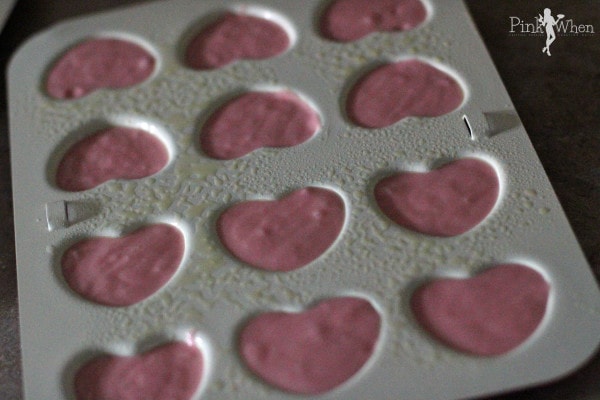 Fill the heart shaped cakes pan