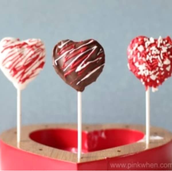 Decorated Cake Pops on a heart shaped tray.