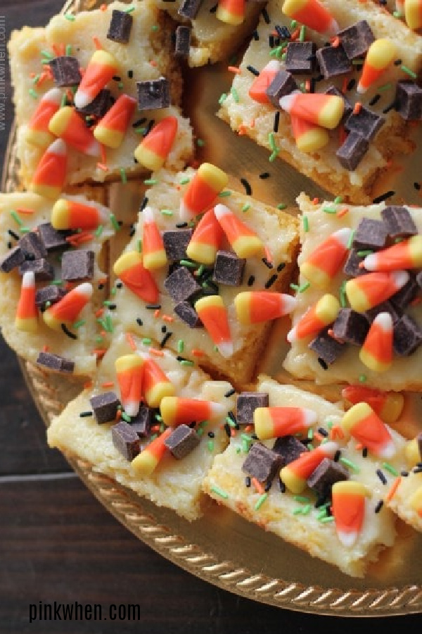 Candy Corn Cheesecake Bars on a gold plate