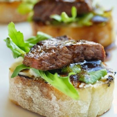 Balsamic Beef Crostini with Herbed Cheese and Arugula