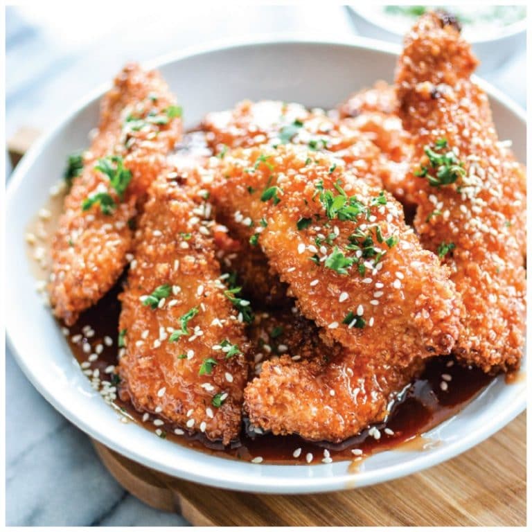 These sweet and sticky chicken strips are so amazing you guys. Chicken breast is sliced up into thin strips, dredged in a crispy, crunchy panko bread crumb mixture and then baked to golden perfection.