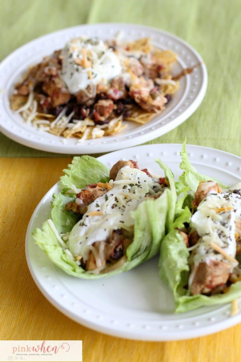 chicken crock pot tacos on a bed of lettuce or on a bed of tortilla chips on white plates.