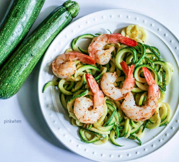 Shrimp scampi zoodles on a white plate