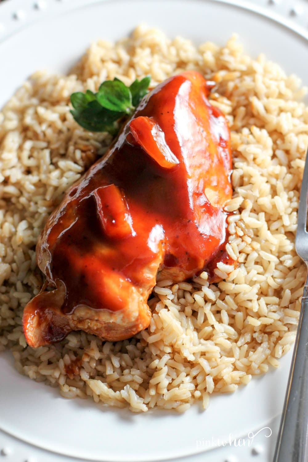 Instant Pot Hawaiian Chicken served over a bed of rice on a white plate. 