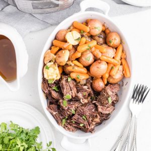 Instant Pot Pot Roast in a dish and ready to serve.