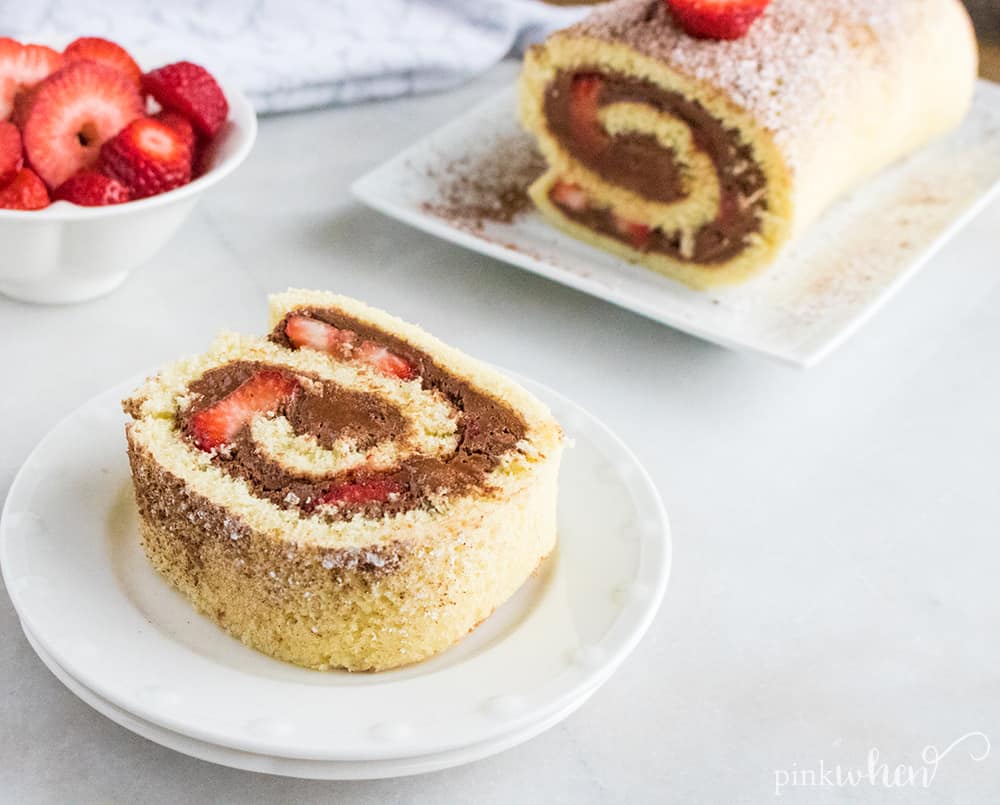This is one of our new favorite dessert recipes - full of delicious chocolate strawberry flavor! This chocolate ganache cake roll recipe is so sweet, spongey, moist, and delicious! This chocolate roll cake will easily become a favorite in your household!