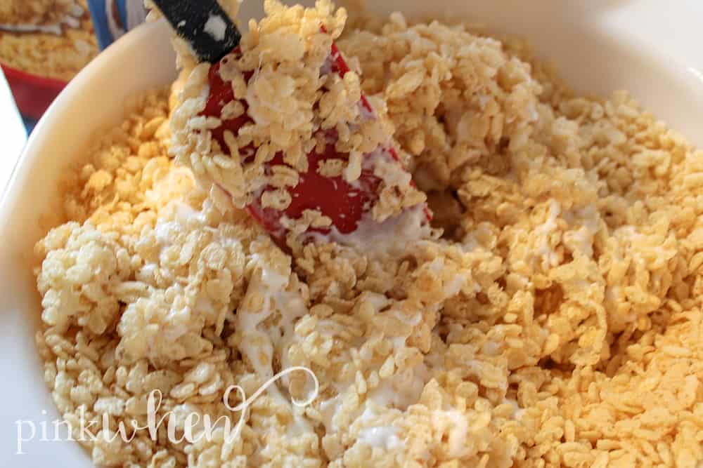 This is a new favorite no bake dessert that has been a hit in our household! These watermelon rice krispie treats are gooey, sweet, delicious, and so much fun! They are sure to be a huge hit with the kids and they will have a blast making them.