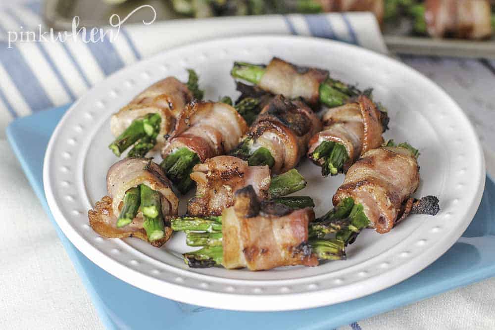 Quick and easy bacon wrapped asparagus. The perfect addition to any menu for the grill. #bacon #asparagus #sidedish #grilledrecipe