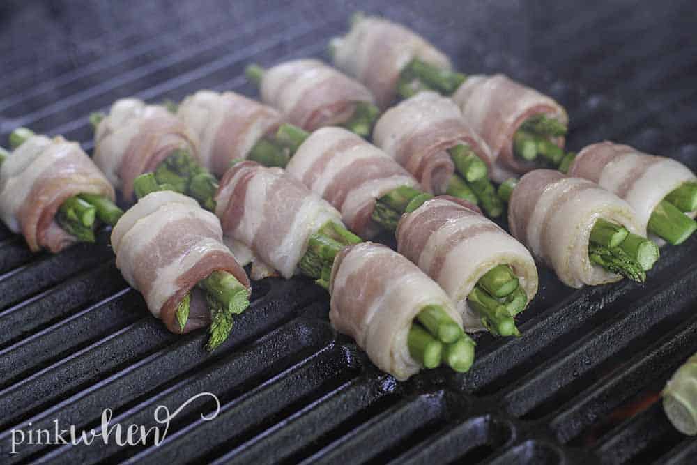 Quick and easy bacon wrapped asparagus. The perfect addition to any menu for the grill. #bacon #asparagus #sidedish #grilledrecipe
