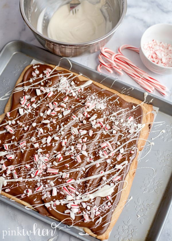 drizzled white chocolate over sugar cookie peppermint bark