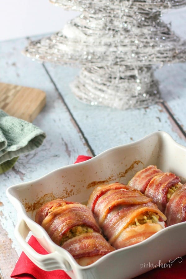 fully cooked bacon wrapped chicken in a white dish