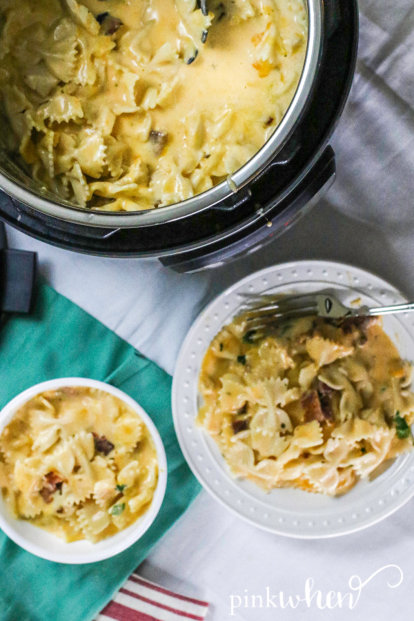Instant Pot Crack Chicken Pasta in a bowl and Instant Pot on white linen. 