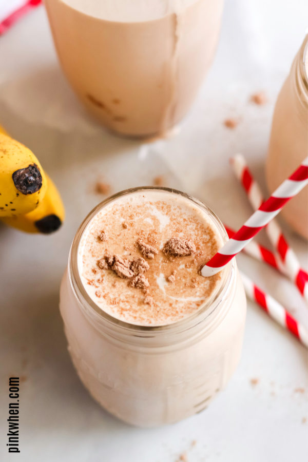 Peanut Butter Smoothie with red and white straw.