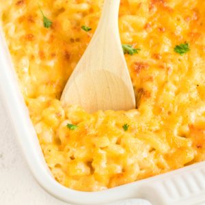 Baked Macaroni and Cheese being scooped from a dish.