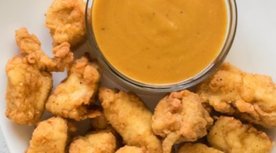 Chick Fil A Sauce and nuggets on a white plate