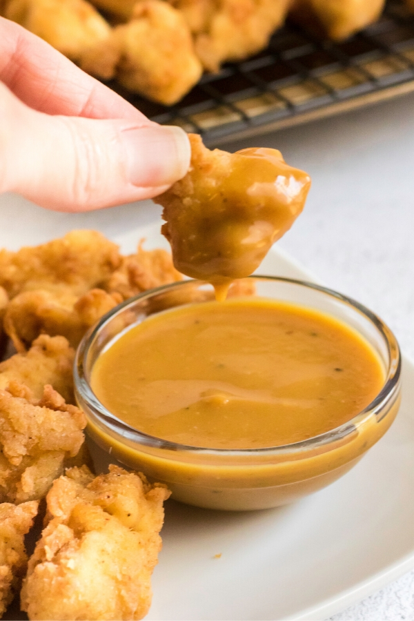 Dipping nuggets into homemade Chick Fil A sauce. 