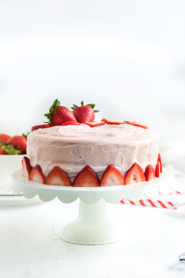 Strawberry Cake on a cake platter ready to serve.