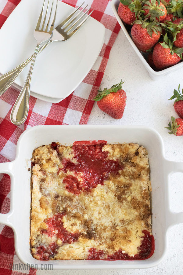 Strawberry cobbler in a baking dish ready to serve. 
