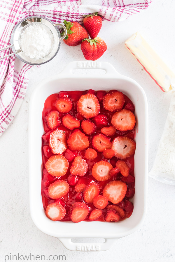 fresh cut strawberries in a 9 x 13 dish