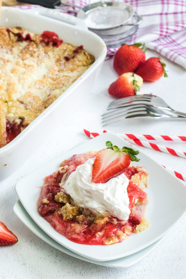 This delicious strawberry dump cake is made with strawberry filling, fresh strawberries, powdered sugar, vanilla cake mix, and butter. It's one of my favorite easy desserts that is as easy as dumping the ingredients and baking. If you love fresh strawberries packed with tons of sweet flavors you're going to love this easy strawberry dessert.