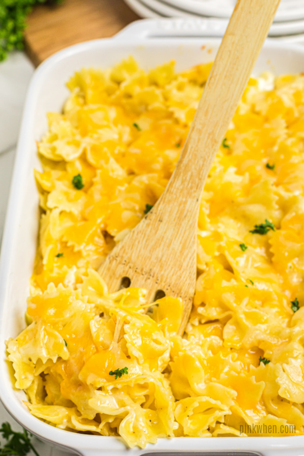 Bowtie Mac and Cheese recipe scooped in a baking dish.