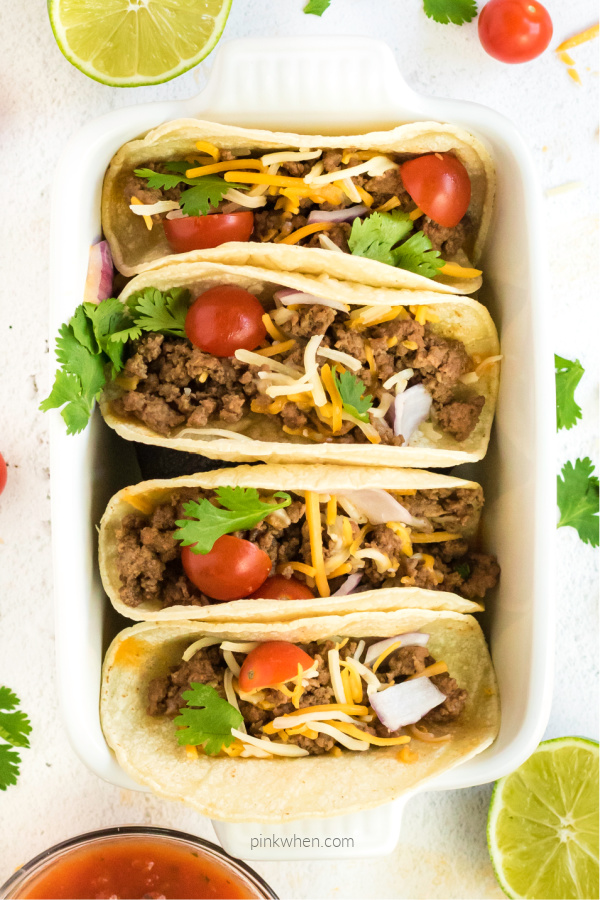 Ground beef street tacos in a baking dish ready to eat.