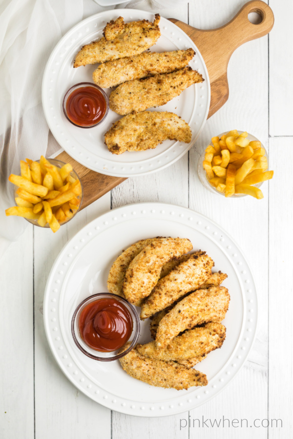 Air Fryer Chicken Strips on a white plate and ready to serve. 
