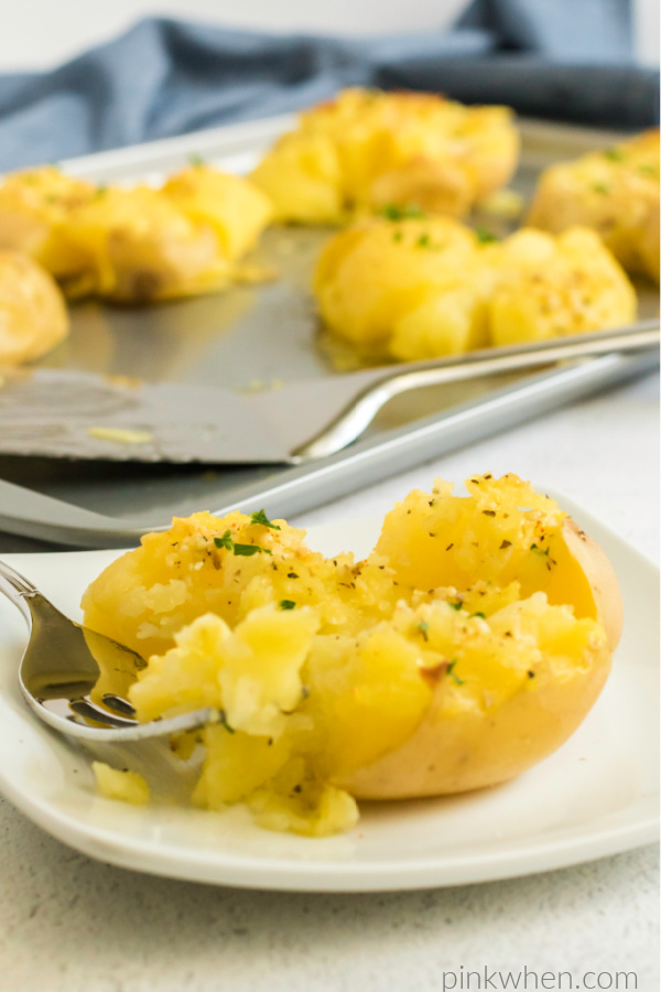 Garlic smashed potato on a plate and ready to serve. 