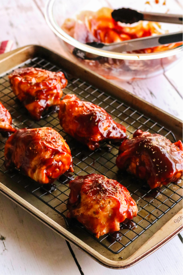 oven baked bbq chicken on a cooling rack.