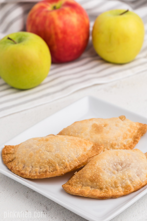 Apple hand pies on a plate and ready to serve.