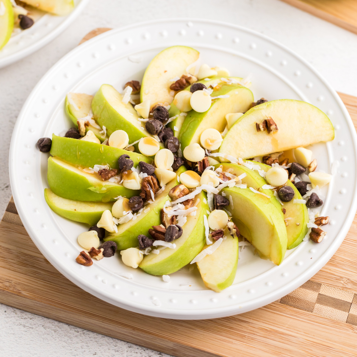 Caramel Apple Nachos with chocolate chips, pecans, and coconut.
