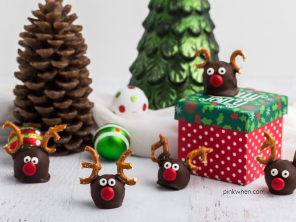 Reindeer truffles arranged around Christmas boxes