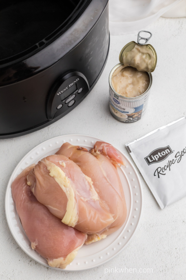 Ingredients needed to make chicken and gravy in the slow cooker. 