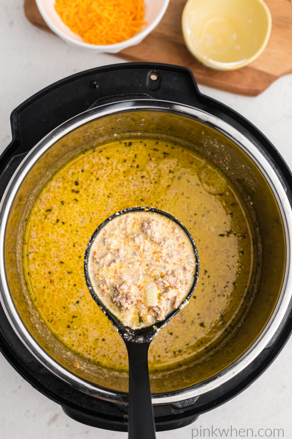 Scoop of cheeseburger soup in the Instant Pot