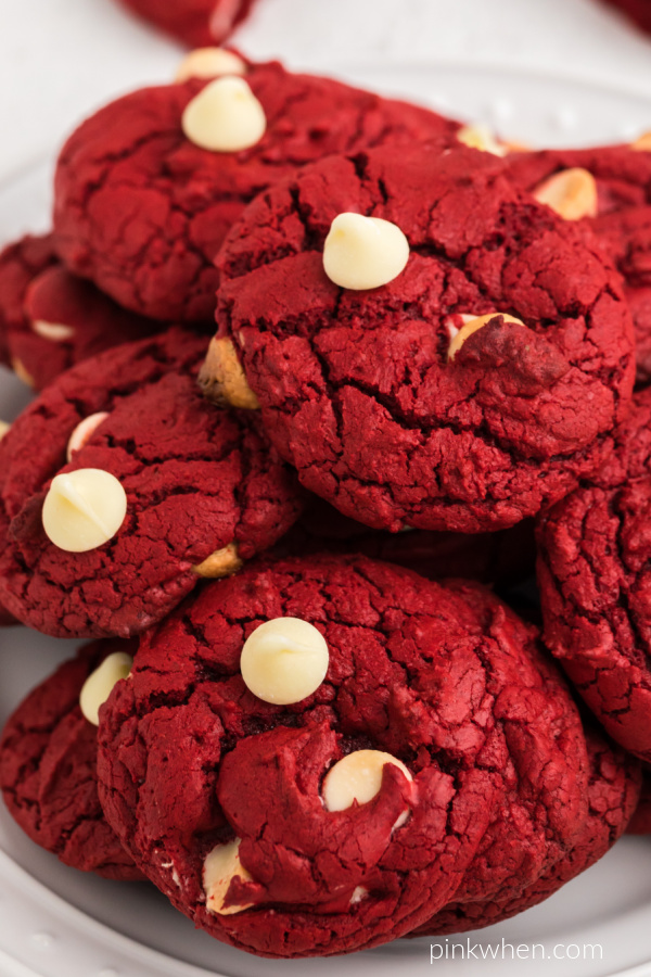 Close up photo of red velvet cookies made with cake mix on a white plate.