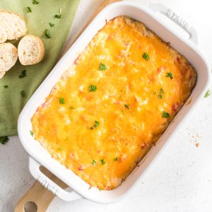 Cheesy Hot Crab Dip in a casserole dish ready to eat.
