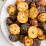 air fryer roasted potatoes seasoned and garnished with fresh parsley.