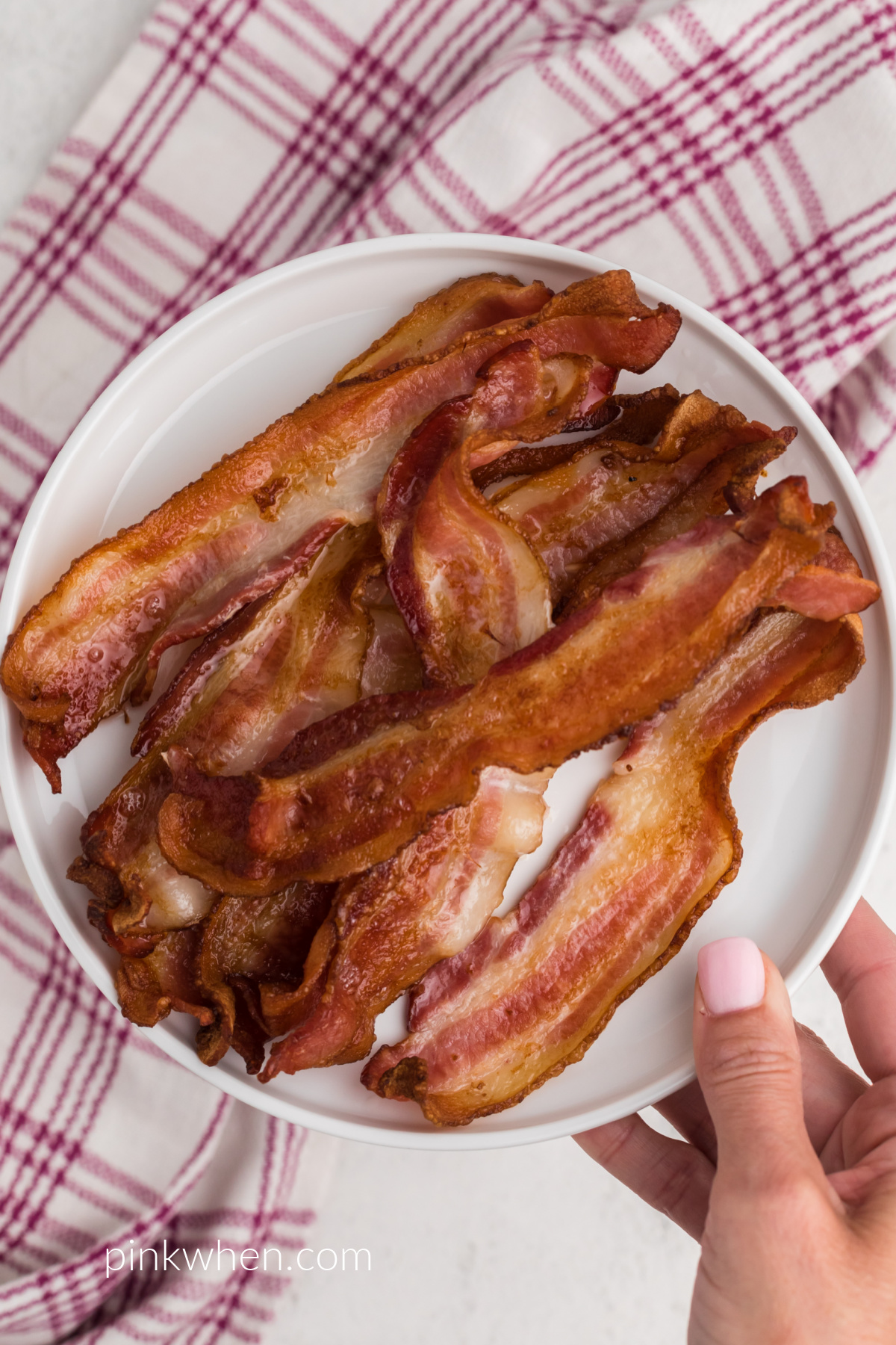 Crispy Air Fried Bacon on a white plate ready to eat. 