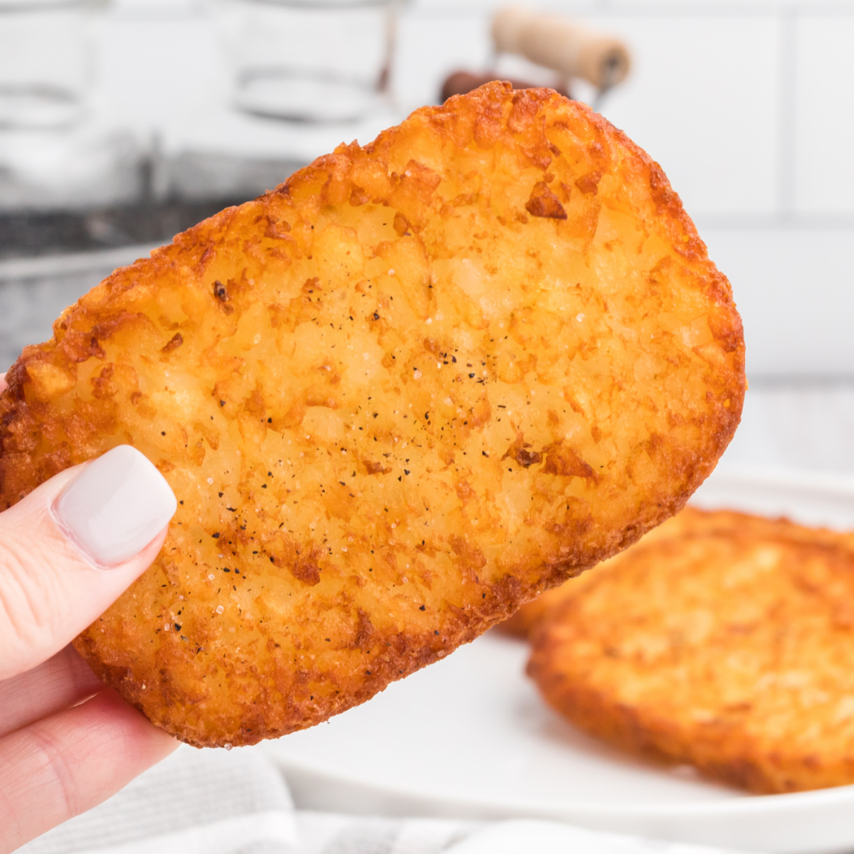 frozen hash brown patties full cooked to a crispy golden brown and ready to eat.
