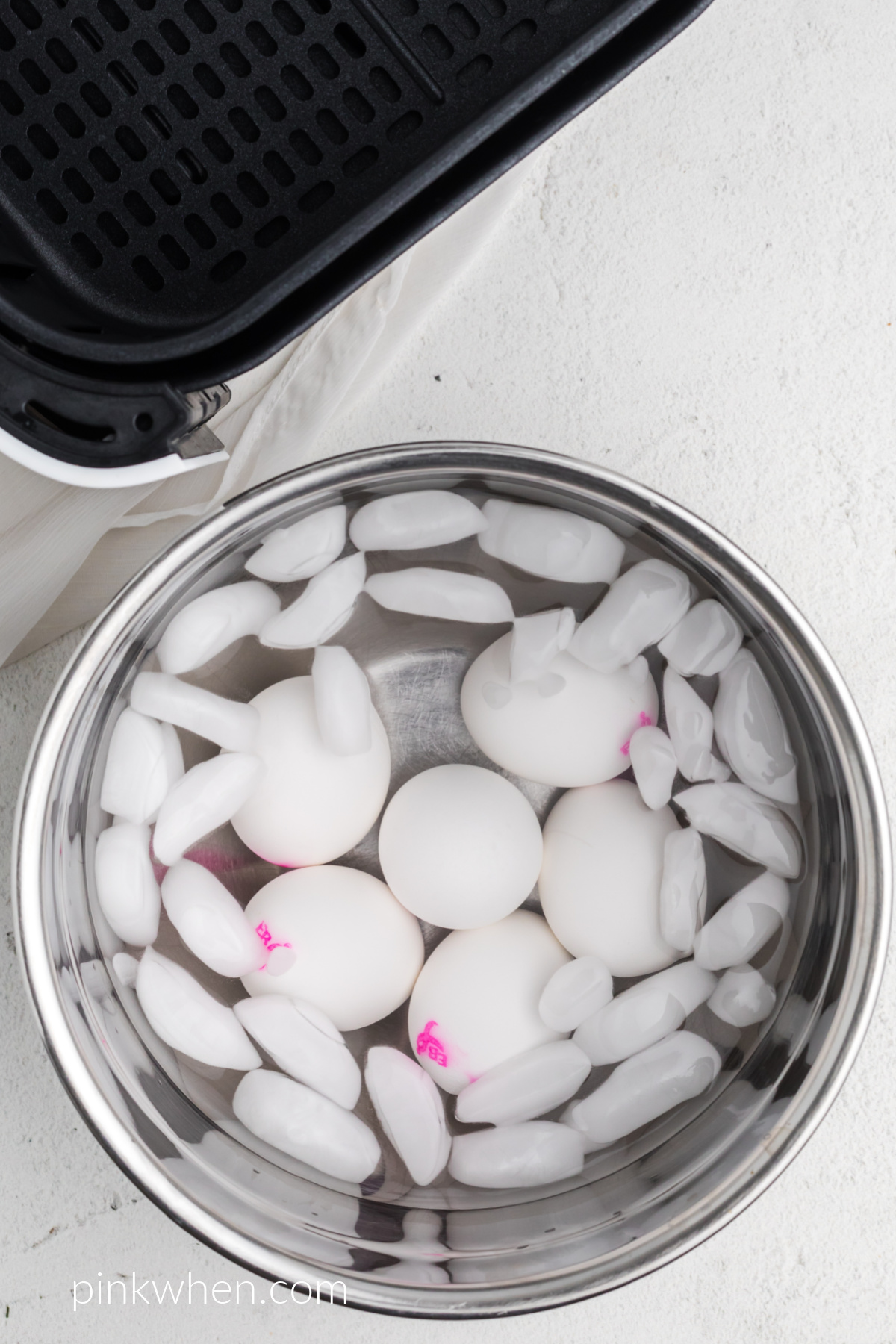 Eggs in a cold ice bath after cooking in the air fryer.