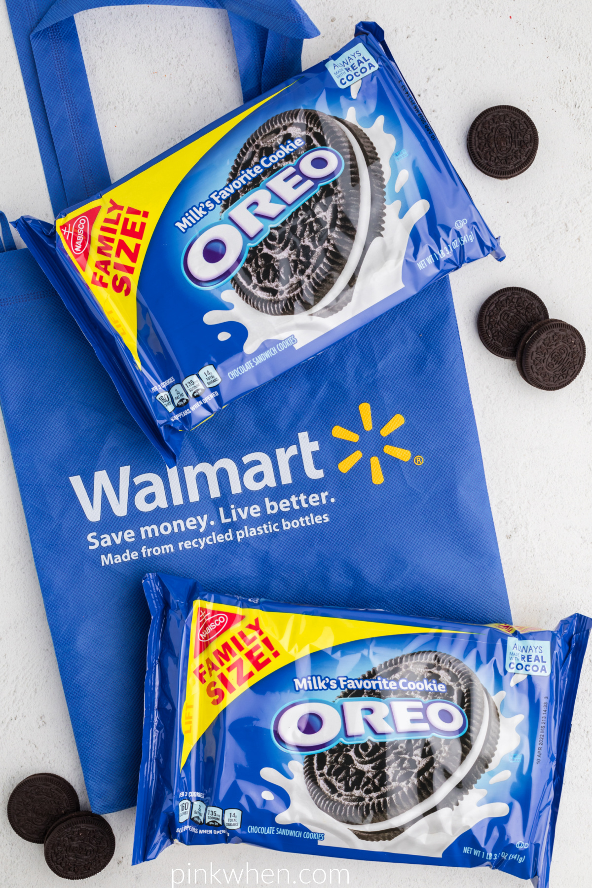 OREO cookies in boxes and on a white table over a blue Walmart bag. 