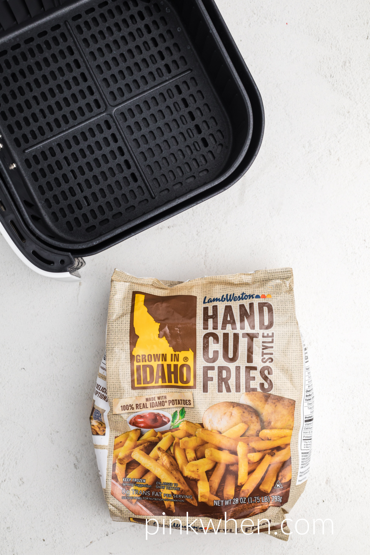 Frozen french fries in a bag ready to be placed into the basket of the air fryer.