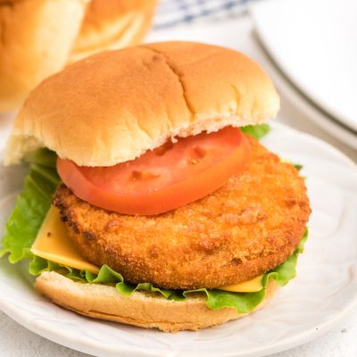 Fully cooked frozen chicken pattie made in the air fryer and dressed on a bun.