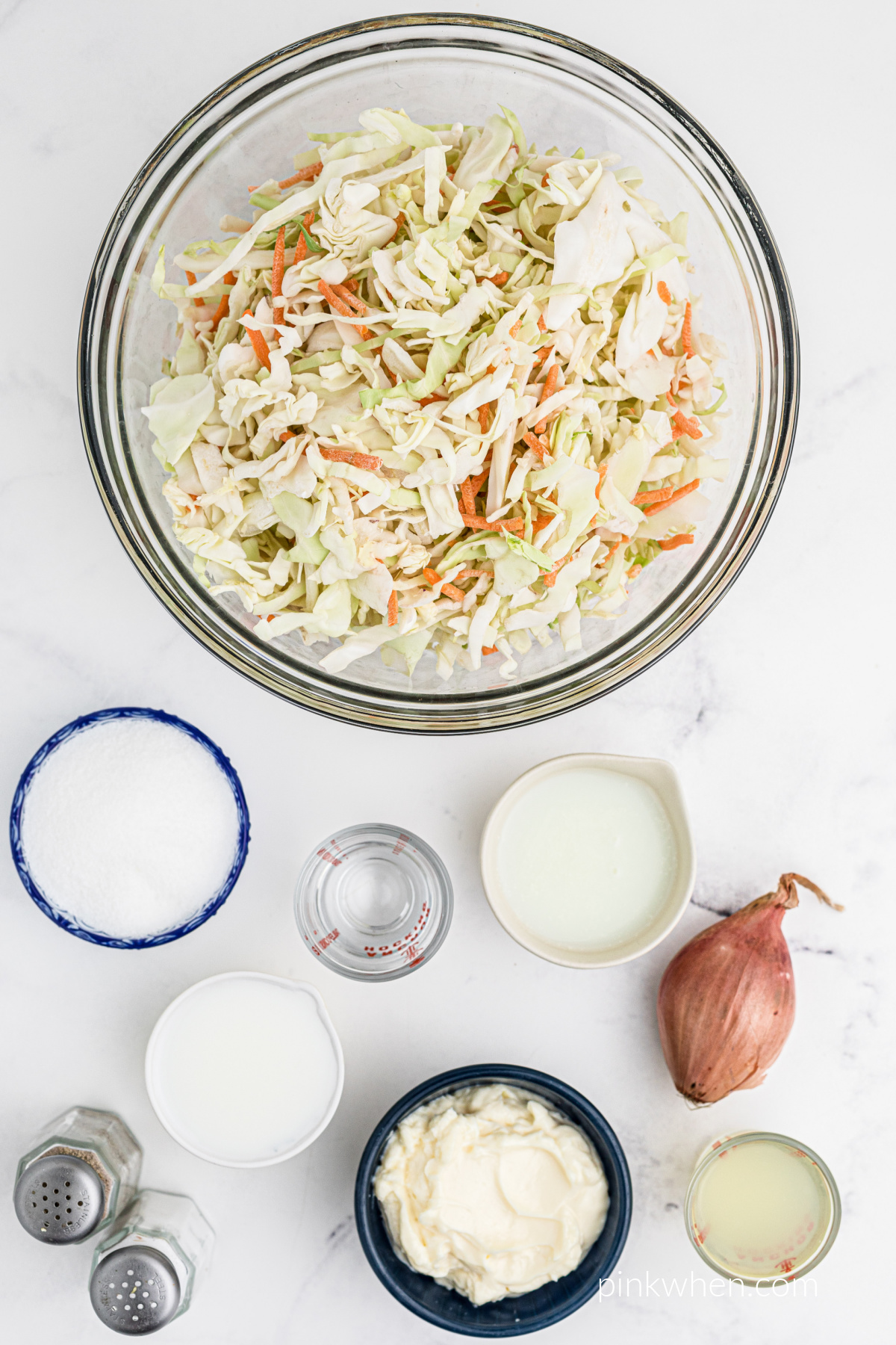 Shredded cabbage and ingredients needed to make copycat KFC coleslaw.