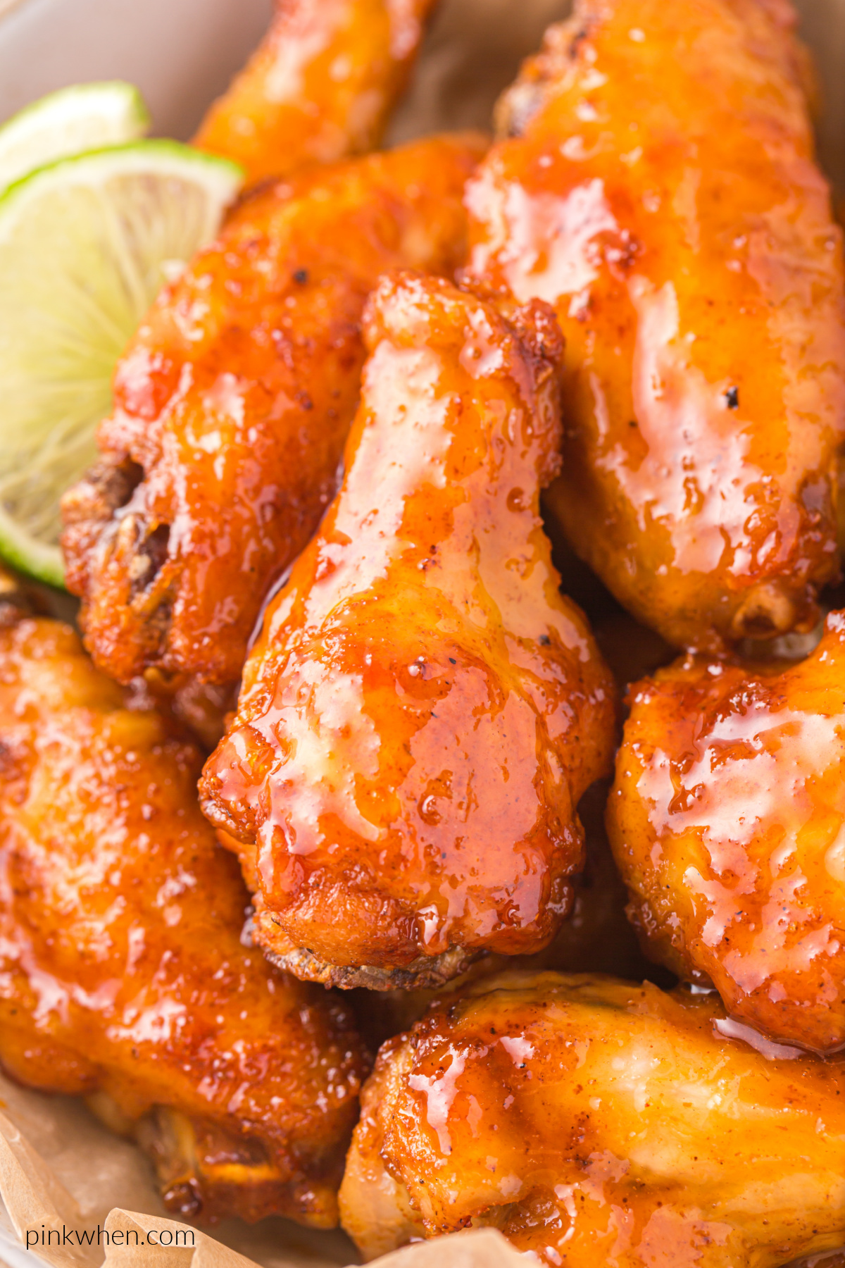 Close up of air fried honey sriracha chicken wings.