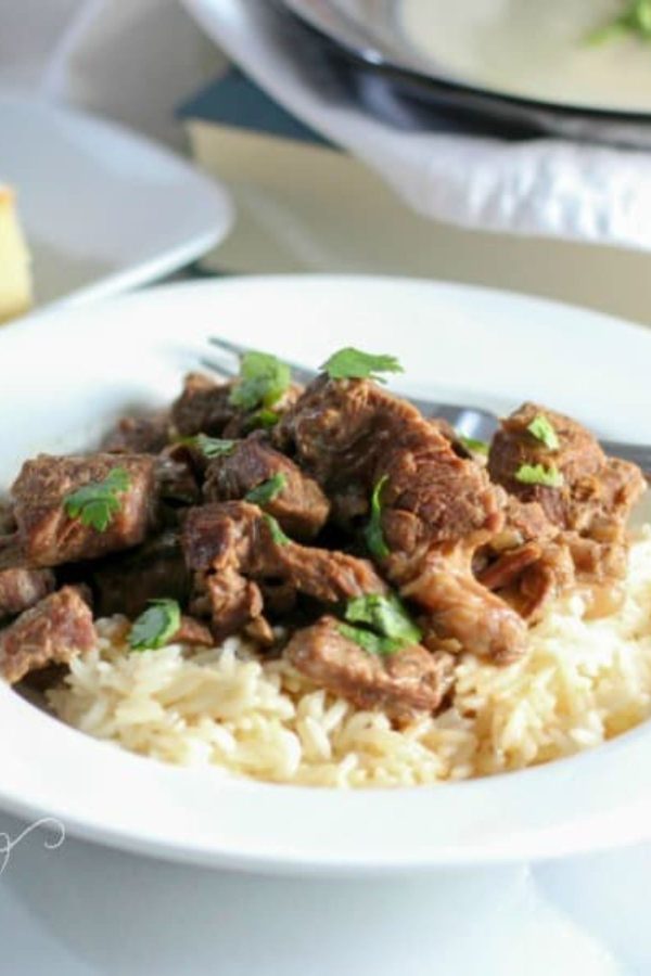 Juicy Beef tips served on rice in a white bowl