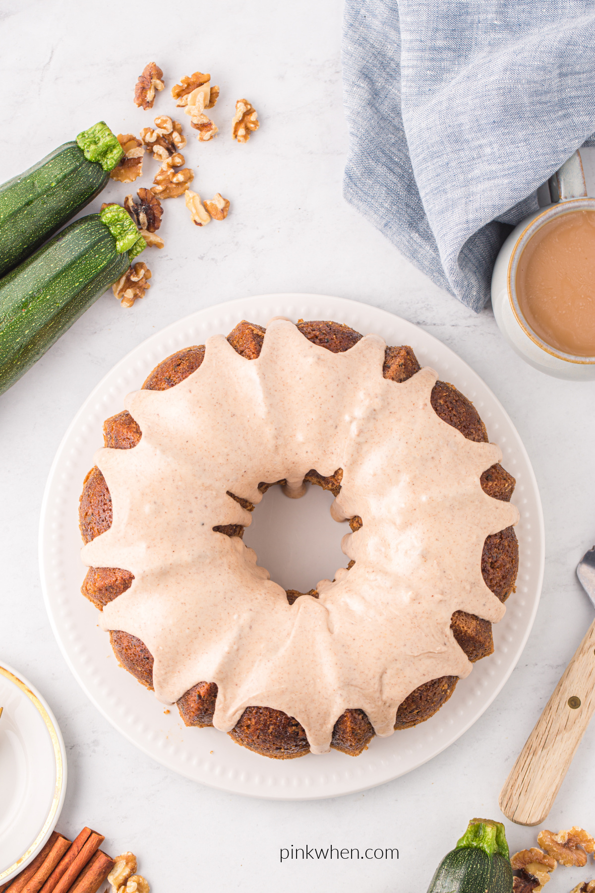 Zucchini bundt cake with icing drizzled over the top.