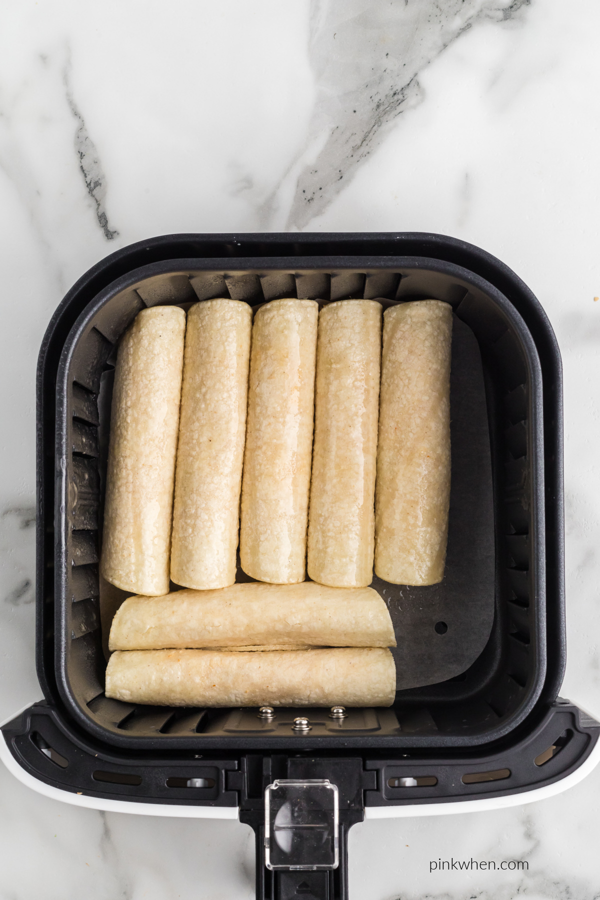 Chicken taquitos rolled and ready to air fry.