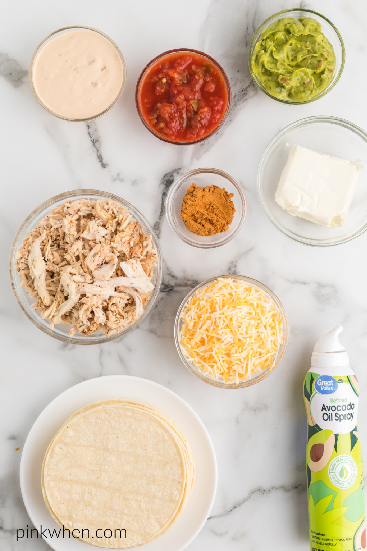 tortillas, chicken, cheese, cream cheese, taco seasoning, and other ingredients used to make chicken taquitos.