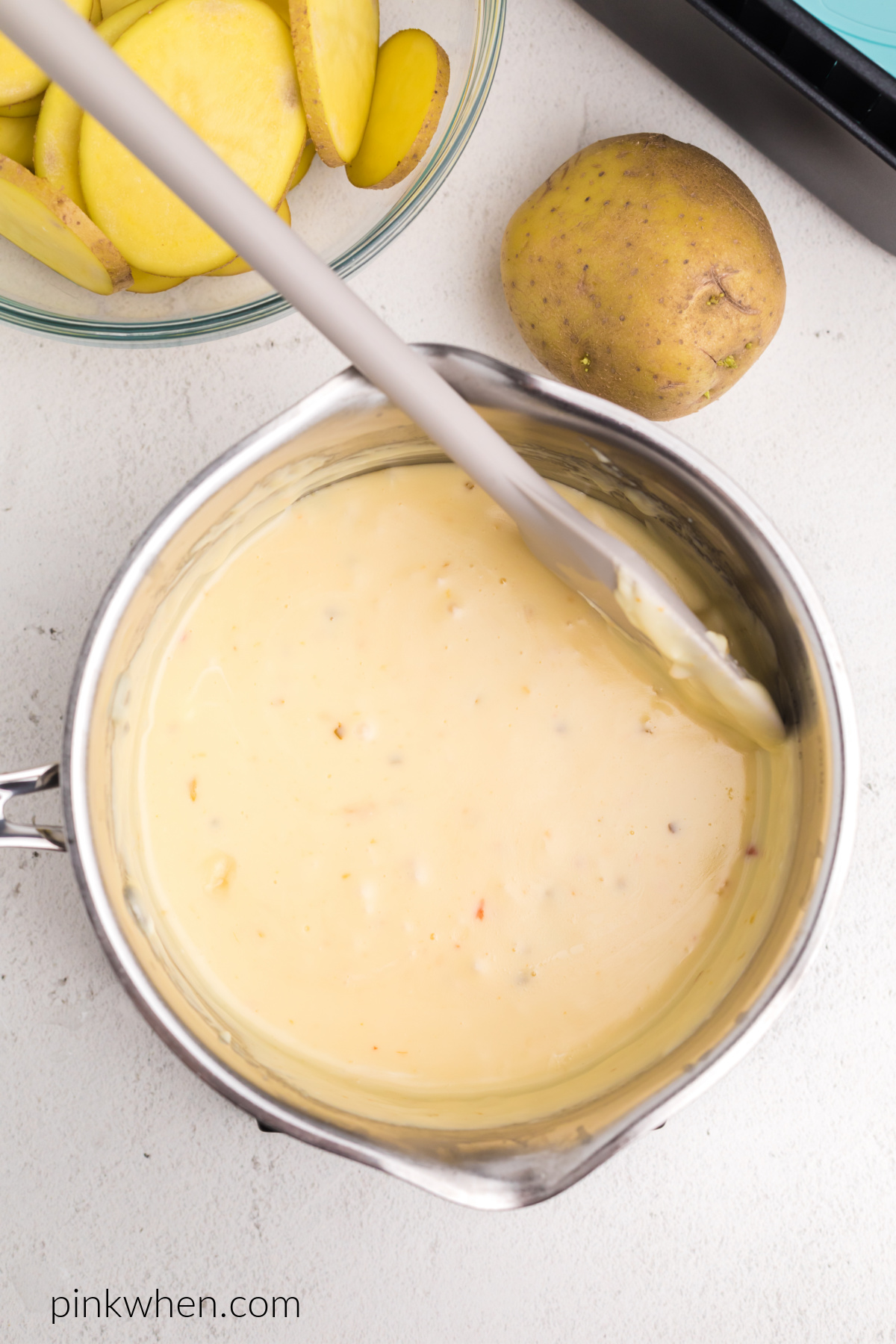 Queso, cream cheese, and butter in a saucepan.